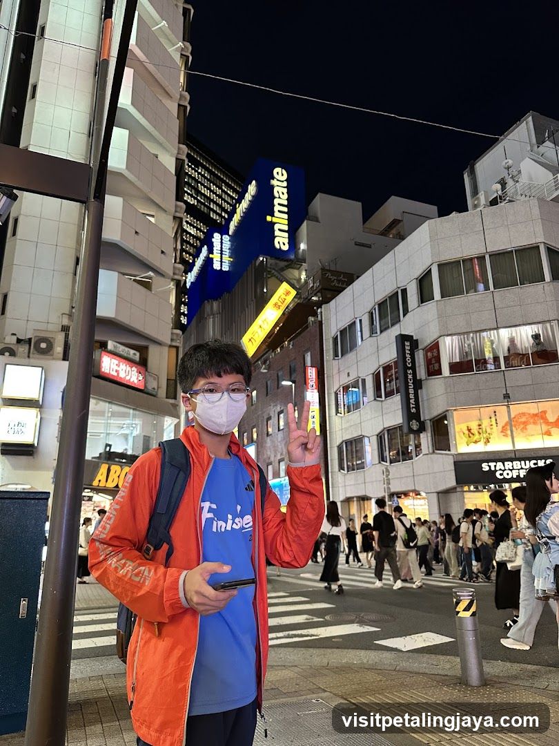 Night street scene with person posing