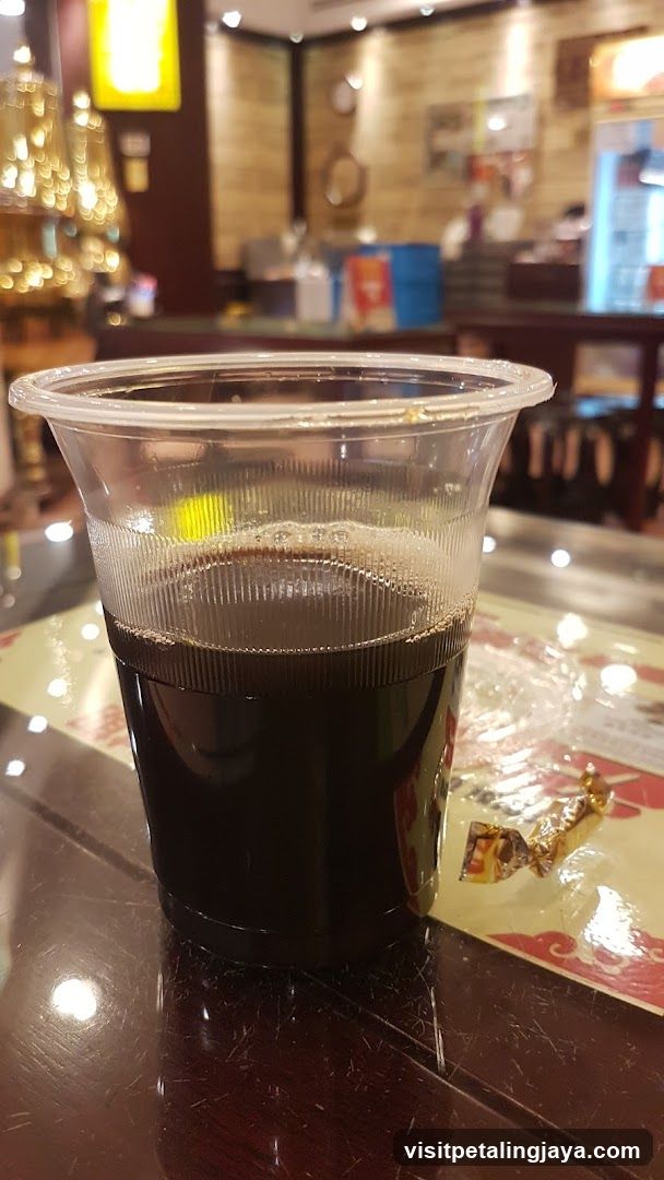 Dark beverage in plastic cup