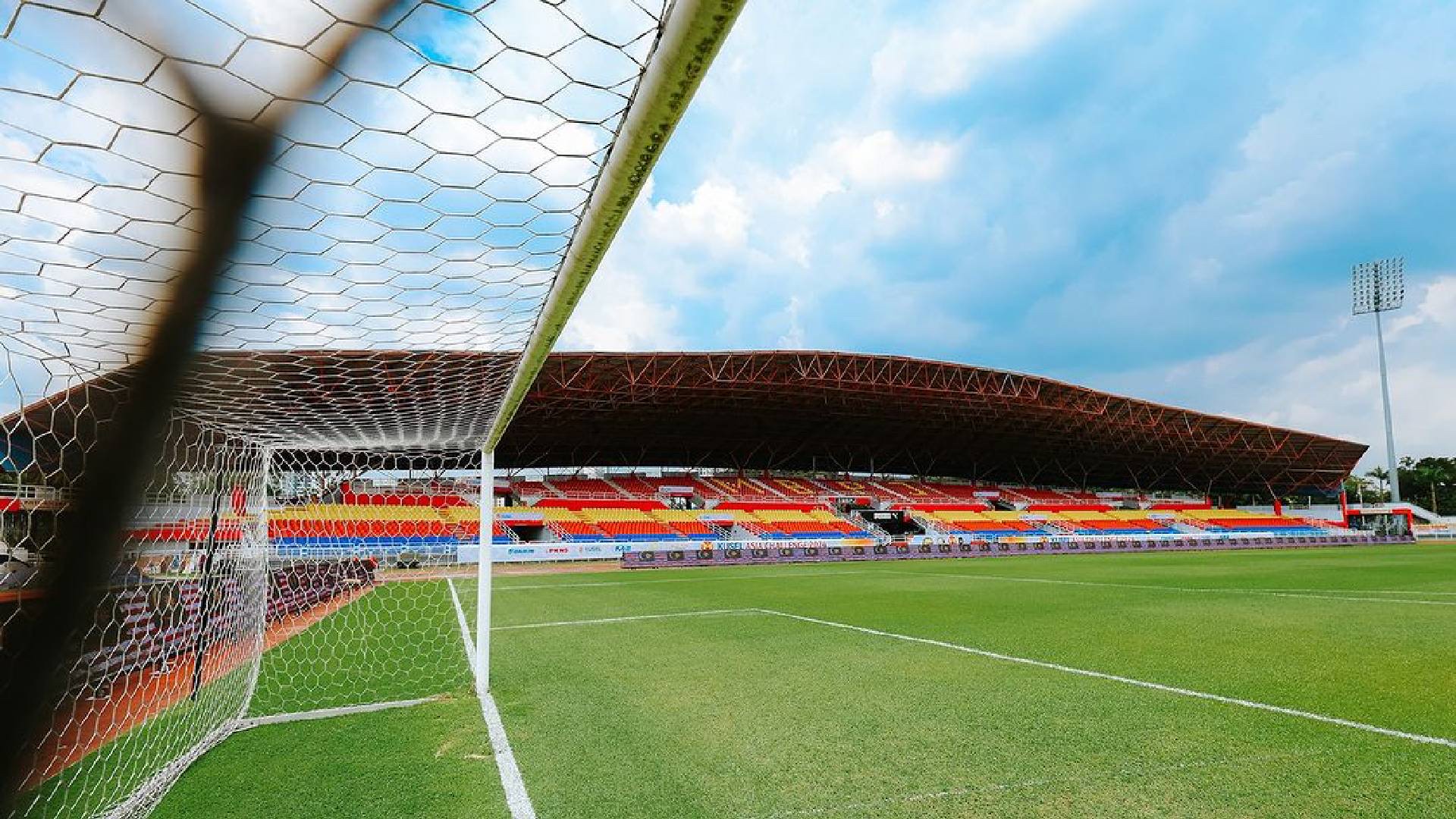 Pitch and main stand at Stadium MBPJ in SS7 Kelana Jaya, seen through the goal net